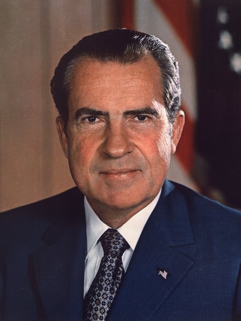 Richard Nixon in a dark suit in his official presidential portrait as the 37th president of the United States