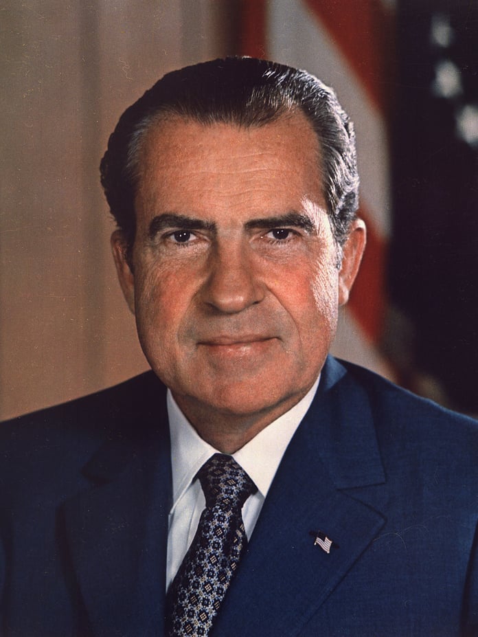 Richard Nixon in a dark suit in his official presidential portrait as the 37th president of the United States