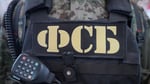 Russian Federal Security Service FSB officers conduct counterintelligence operation after detaining Ukrainian agent in Crimea who mapped air defense positions