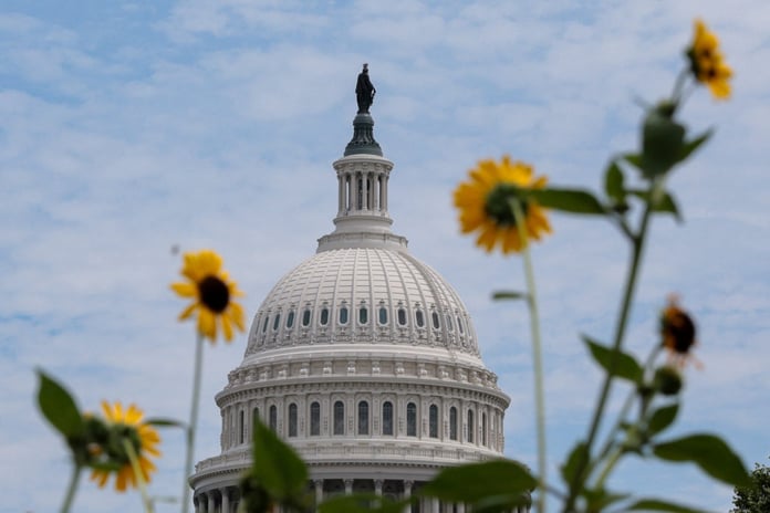 US Capitol building with flower arrangement in foreground as Senate leaders announce bipartisan continuing resolution August 2026