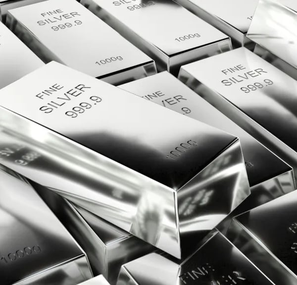 An employee displays a silver bar in a safe deposit room, the metal behind the silver rate today quoted across Indian cities
