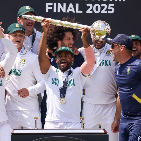 Temba Bavuma lifts the World Test Championship mace surrounded by South Africa teammates at Lord's