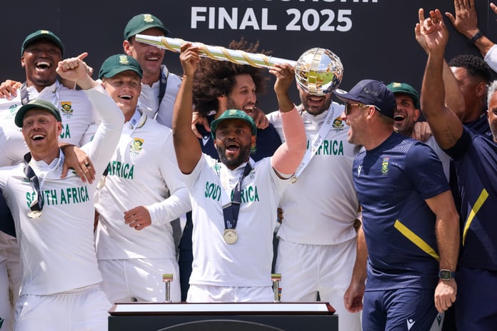 Temba Bavuma lifts the World Test Championship mace surrounded by South Africa teammates at Lord's