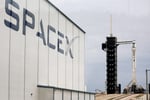 S&P 500 index today: a SpaceX hangar and launch tower, the company the index committee has kept out on profitability grounds