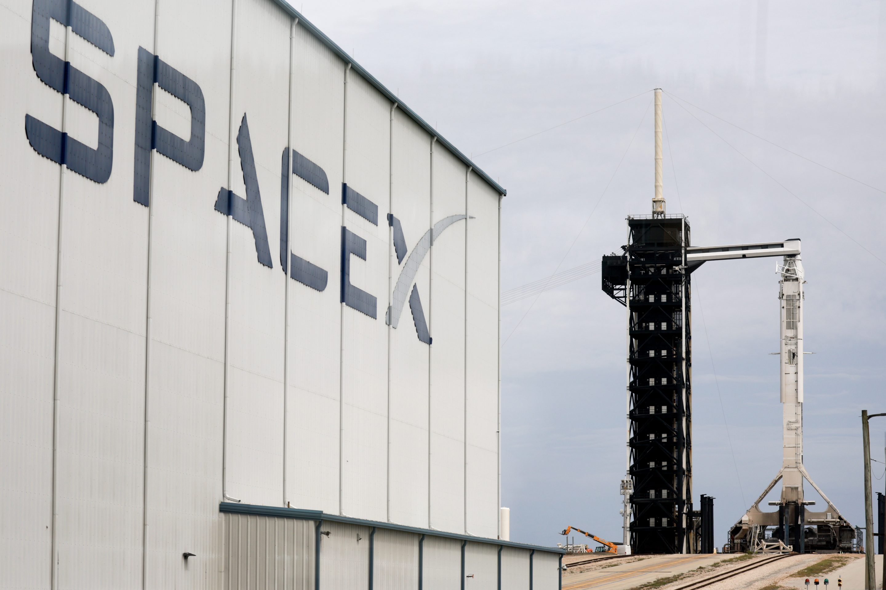 S&P 500 index today: a SpaceX hangar and launch tower, the company the index committee has kept out on profitability grounds