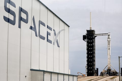 S&P 500 index today: a SpaceX hangar and launch tower, the company the index committee has kept out on profitability grounds