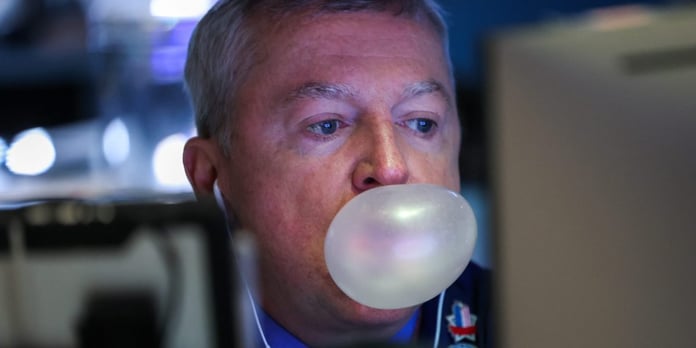 S&P 500 today: a trader blows a chewing gum bubble while working on the floor of the New York Stock Exchange