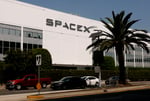 SpaceX IPO stock debut displayed on screen in New York City