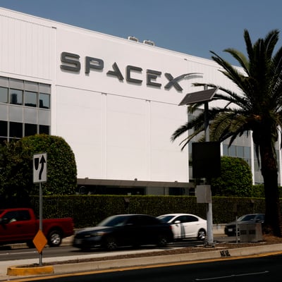 SpaceX IPO stock debut displayed on screen in New York City
