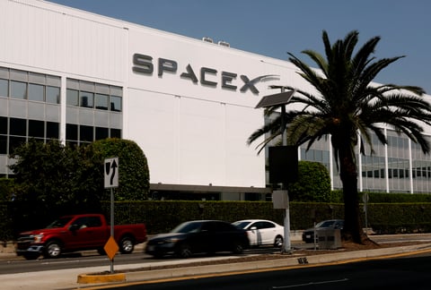 SpaceX IPO stock debut displayed on screen in New York City