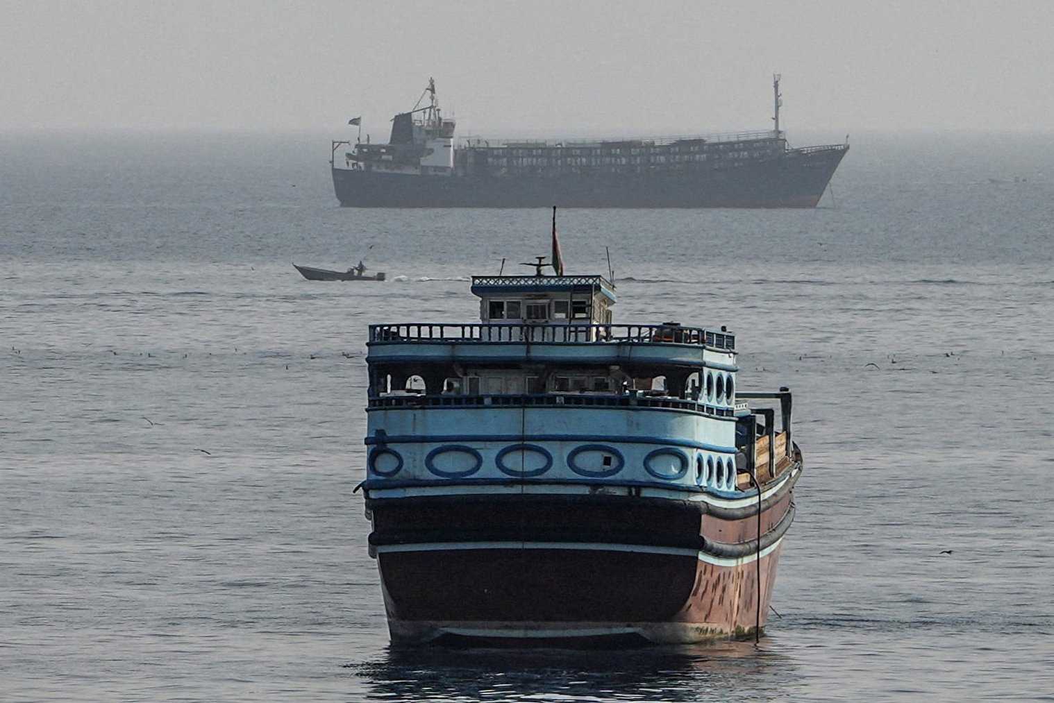 Vessels navigating the Strait of Hormuz as Iran and Oman finalize a preferential trade agreement amid US sanctions