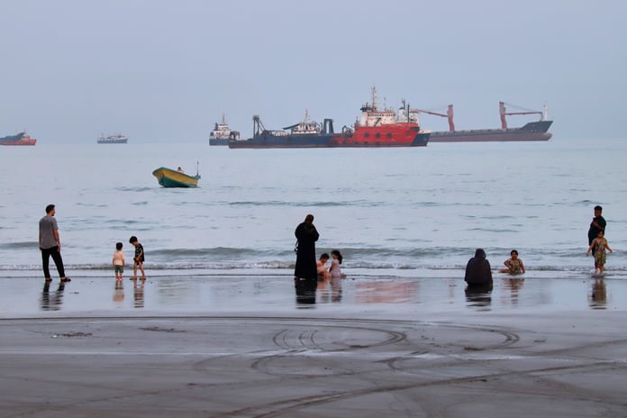 Commercial vessels anchored in the Strait of Hormuz off Bandar Abbas Iran August 2026