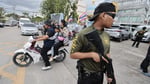 Security officers secure the area after the shooting at Debsirin Nonthaburi School in Thailand, August 7 2026