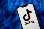 TikTok logo on a smartphone as White House lifts government device ban