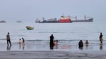 Commercial vessels in the Strait of Hormuz as Trump claims US total control while Iran rejects the assertion