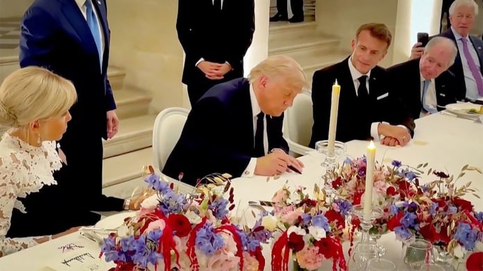 Donald Trump signs the Iran memorandum of understanding at Versailles in June 2026, the ceasefire agreement later declared void in July