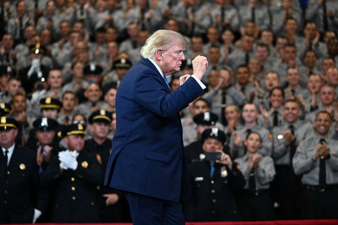 Donald Trump gestures while speaking at the Nassau County Police Academy Center in Garden City New York August 14 2026