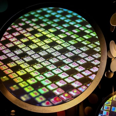 TSMC semiconductor chip wafer displayed at the TSMC Museum of Innovation in Hsinchu Taiwan, showing colorful die patterns