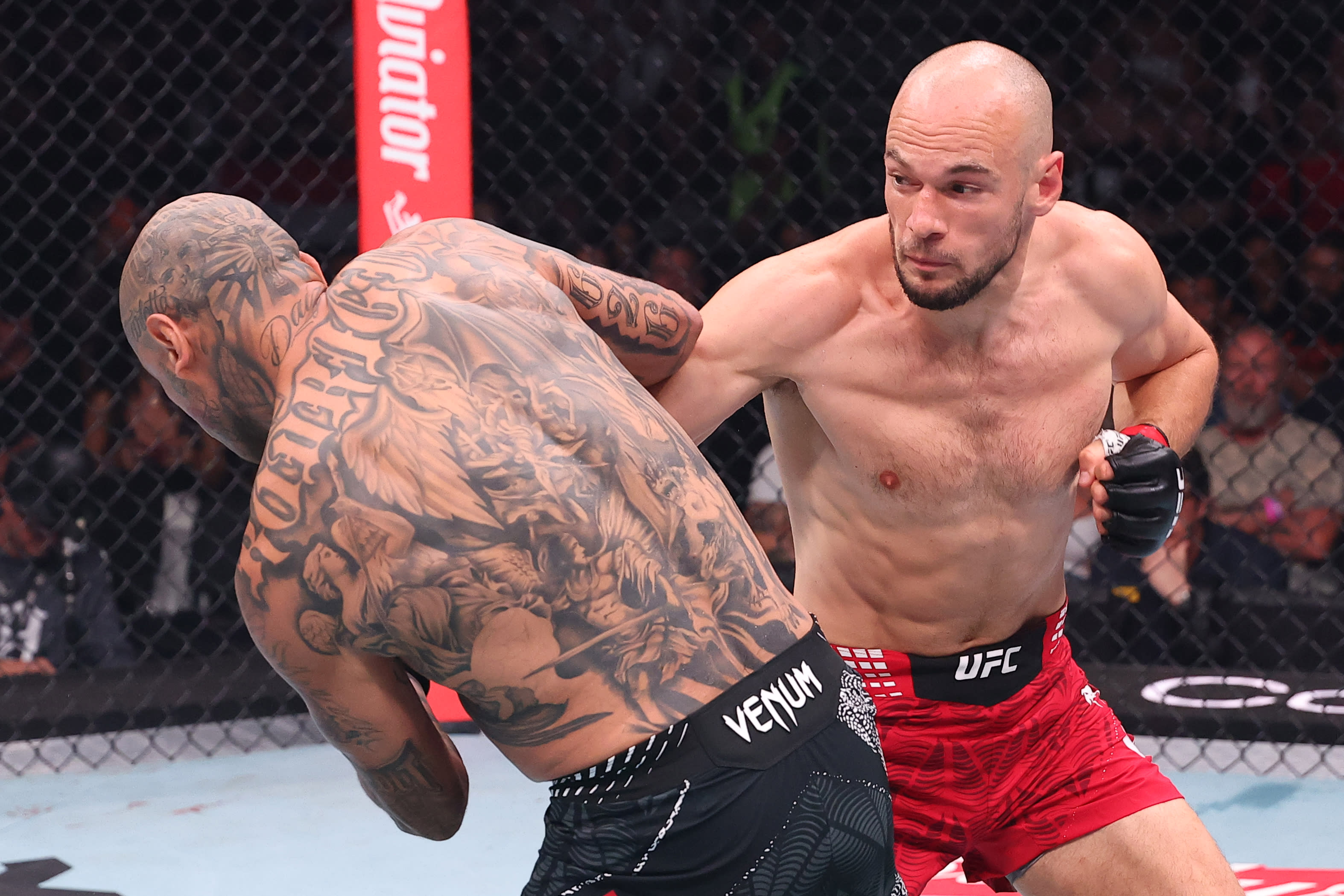 Uroš Medić stands over Daniel Rodriguez after his first-round TKO at UFC Fight Night Belgrade