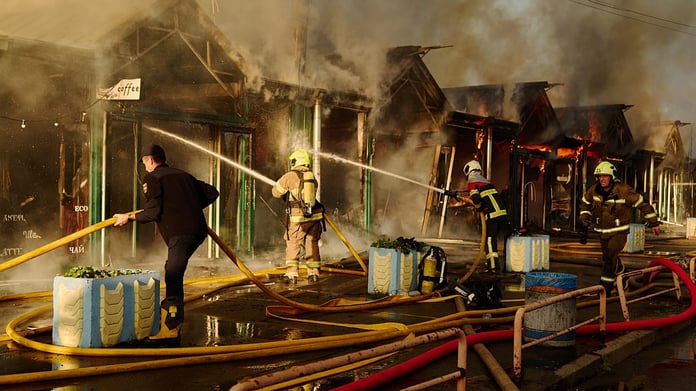 Firefighters battling fire at building damaged in Russian missile strike in Kyiv, Ukraine, August 2026