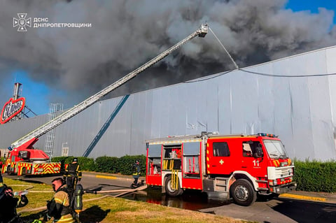 Firefighters respond to Russian drone strike at Kryvyi Rih shopping mall Ukraine war August 2026