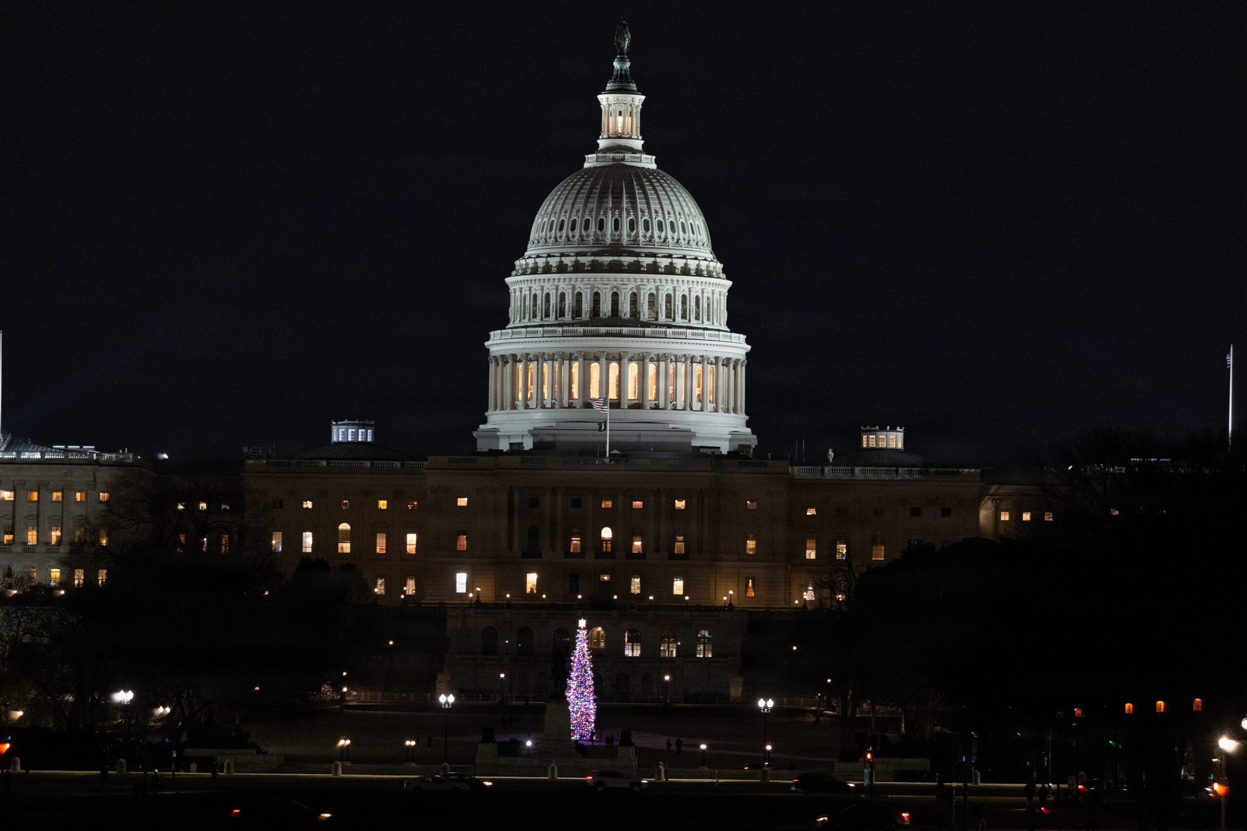 US Capitol building illuminated at night in Washington DC