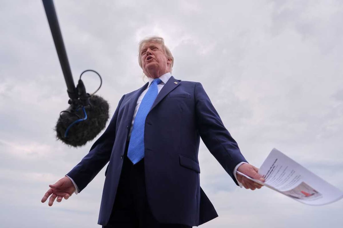 President Donald Trump speaks to reporters before boarding Air Force One at Joint Base Andrews, August 14, 2026