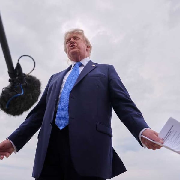 President Donald Trump speaks to reporters before boarding Air Force One at Joint Base Andrews, August 14, 2026