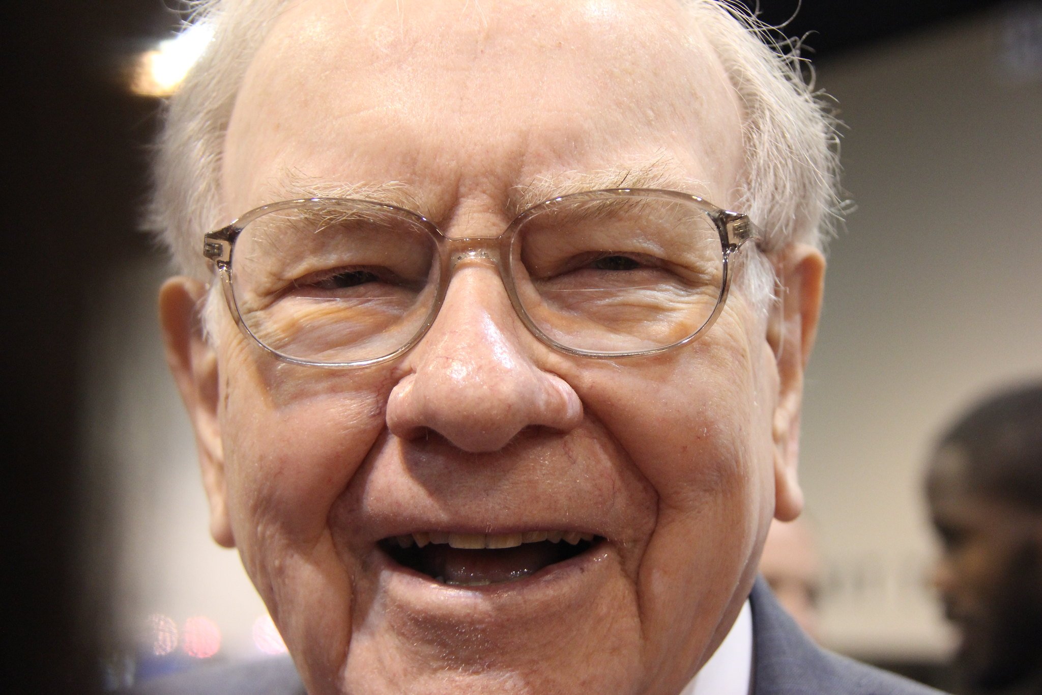 Warren Buffett smiling, founder and former CEO of Berkshire Hathaway who built the company's $397 billion cash reserve