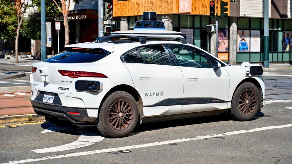 Waymo self-driving car on a California street as the company expands autonomous robotaxi service to Sacramento and San Diego following CPUC approval