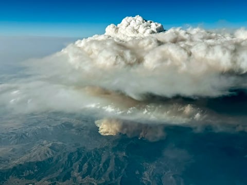 NASA aerial photograph of pyrocumulonimbus fire cloud towering above a western United States wildfire in August 2026