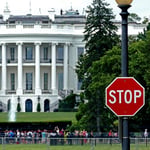 White House exterior with security STOP sign in foreground, Washington DC
