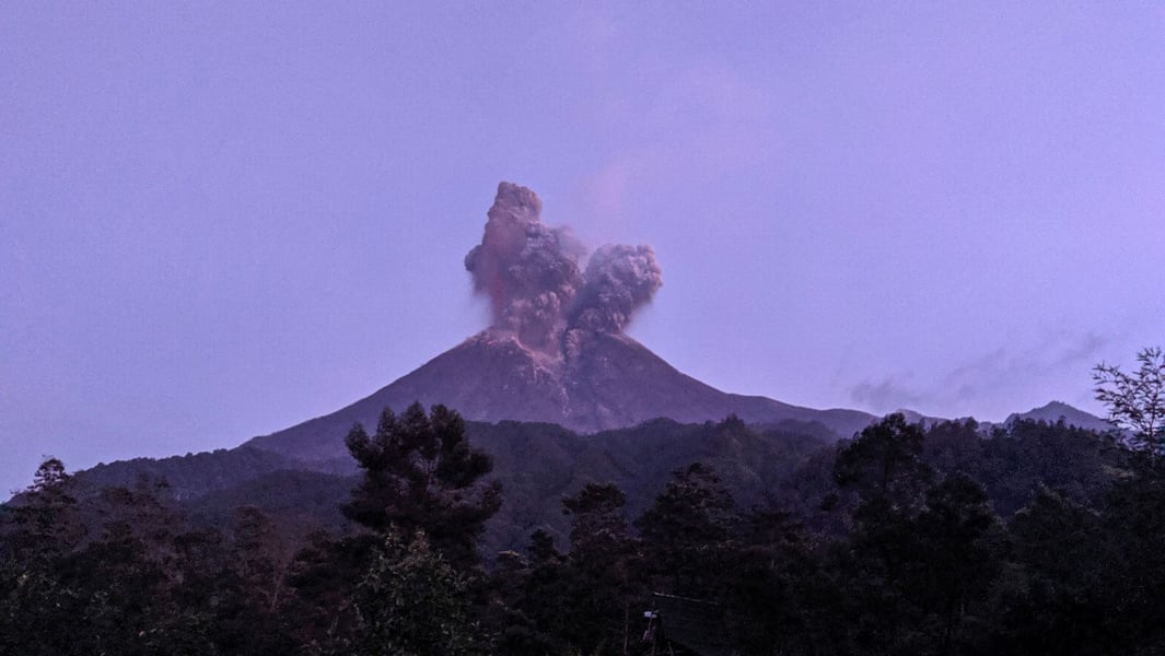 Mount Merapi volcano erupting as seen from Cangkringan district in Sleman Yogyakarta Indonesia