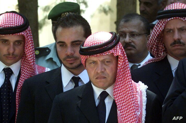 King Abdullah (C) flanked by his brothers (L to R) Crown Prince Hamzah, Prince Ali and Prince Faisal..