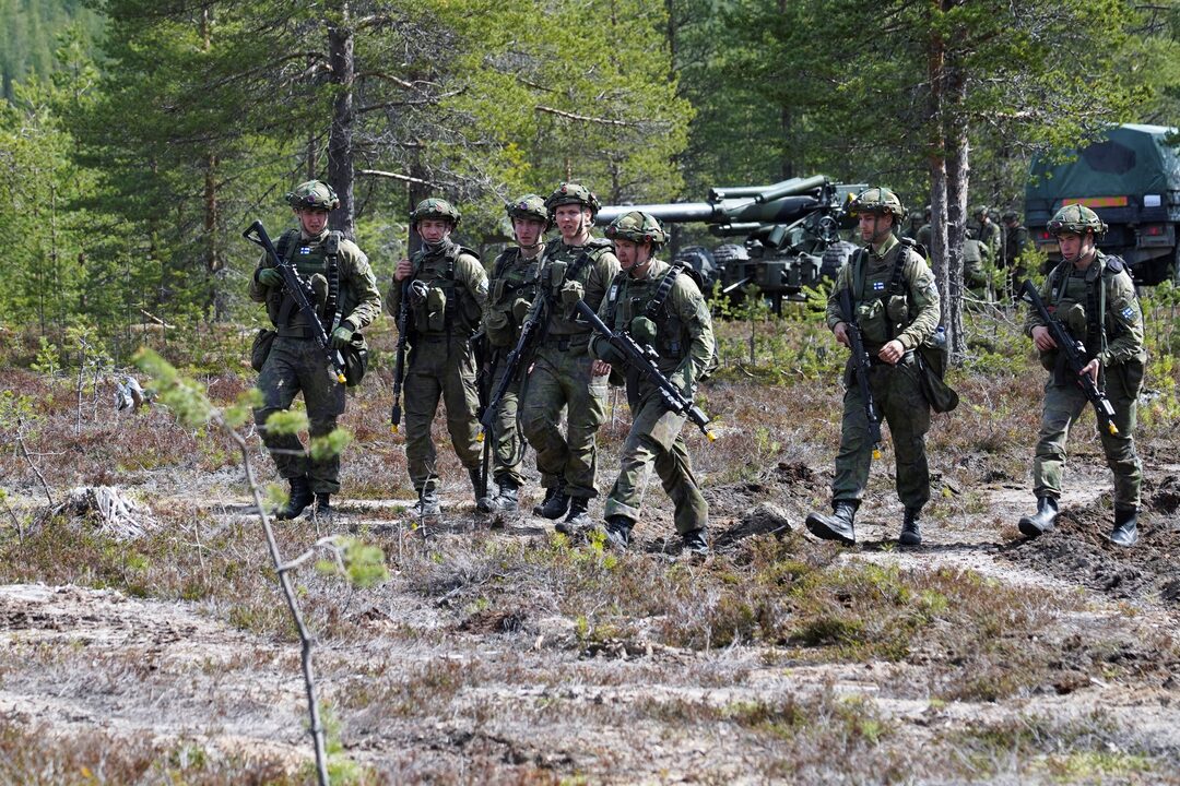 Finnish soldiers walk during the Northern Forest land force exercise in Rovajarvi, Finland