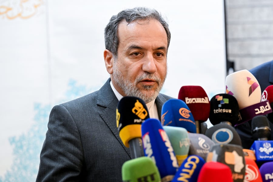 Iranian Foreign Minister Abbas Araghchi speaks to the press after meeting with Syrian officials at the Iranian embassy in Damascus