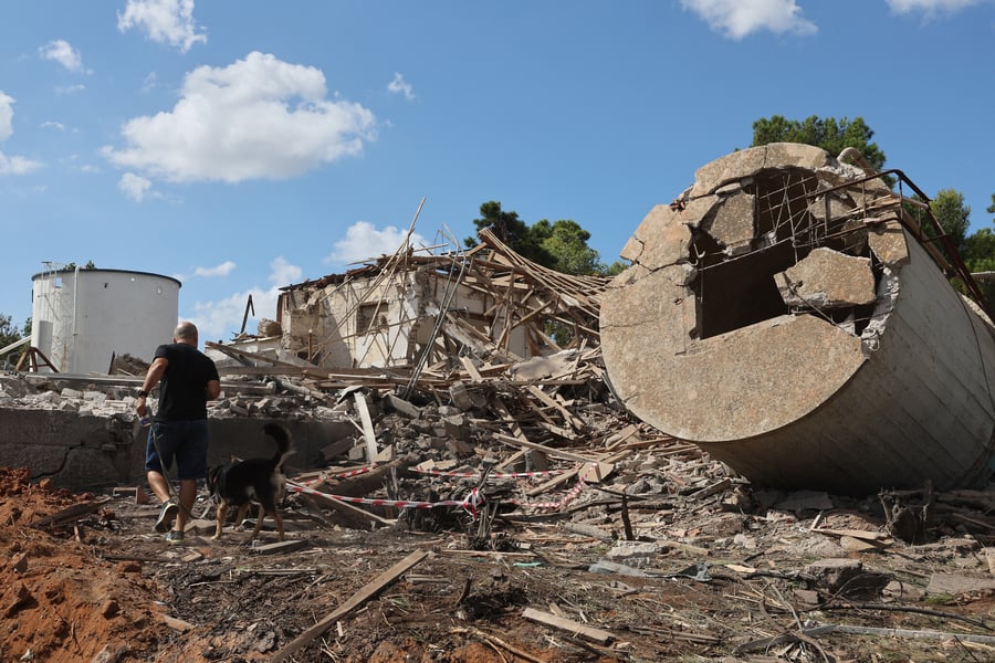 An Israeli man walks past the rubble of a destroyed building in Hod HaSharon in the aftermath of an Iranian missile attack on Israel