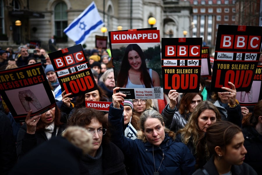 Protesters hold placards demonstration outside the BBC headquarters, in London,