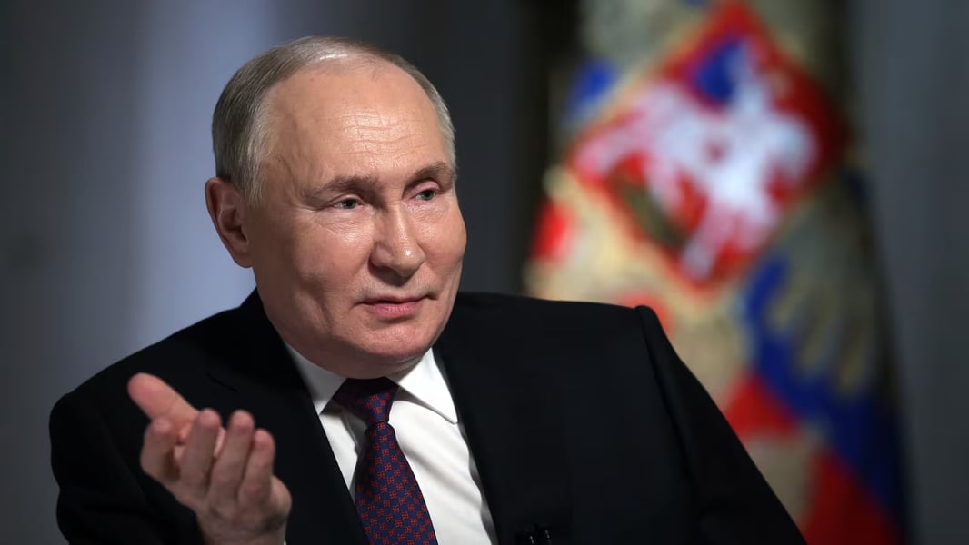 Russian President Vladimir Putin speaks during an interview 