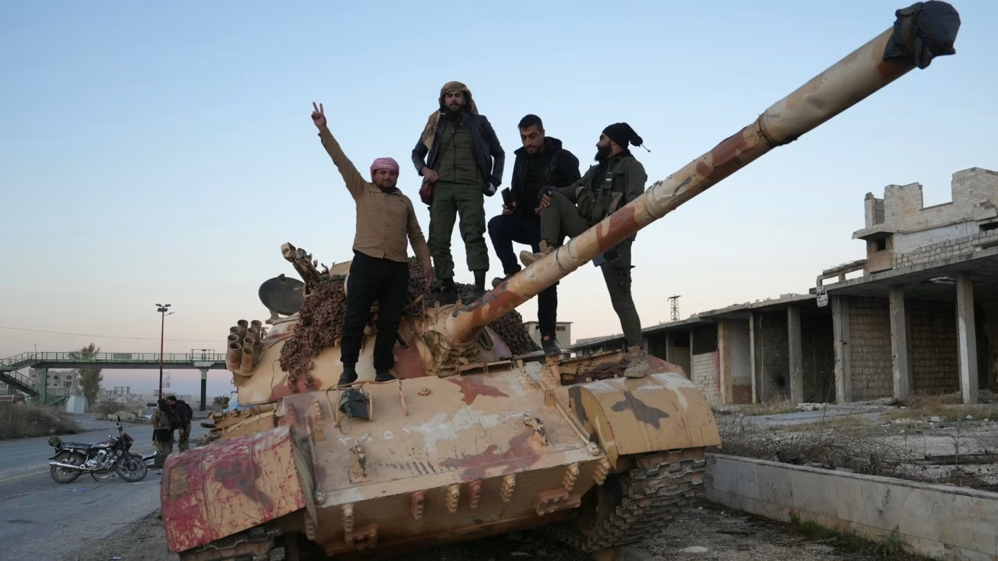 Anti-government fighters celebrate in Syria’s northwestern Idlib province Syria