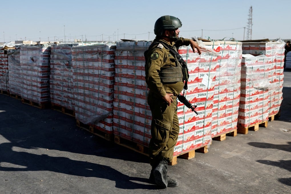 Israeli soldier, Gaza aid, Kerem Shalom crossing, humanitarian parcels, Gaza Strip, Israel blockade, 2025 aid transfer