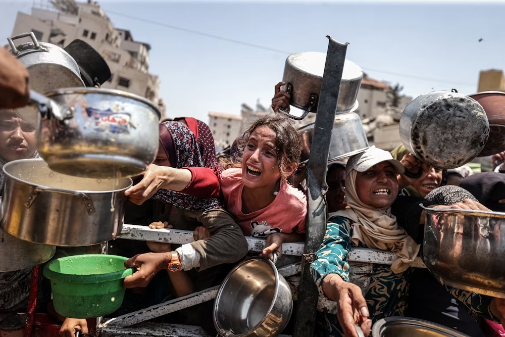 Palestinian families mourn after Israeli strikes on a designated safe zone in Gaza kill children and parents