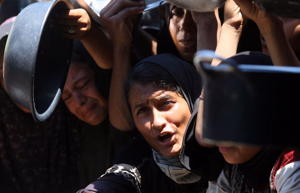 Palestinians, food queue, hunger crisis, Khan Younis, Gaza, charity kitchen
