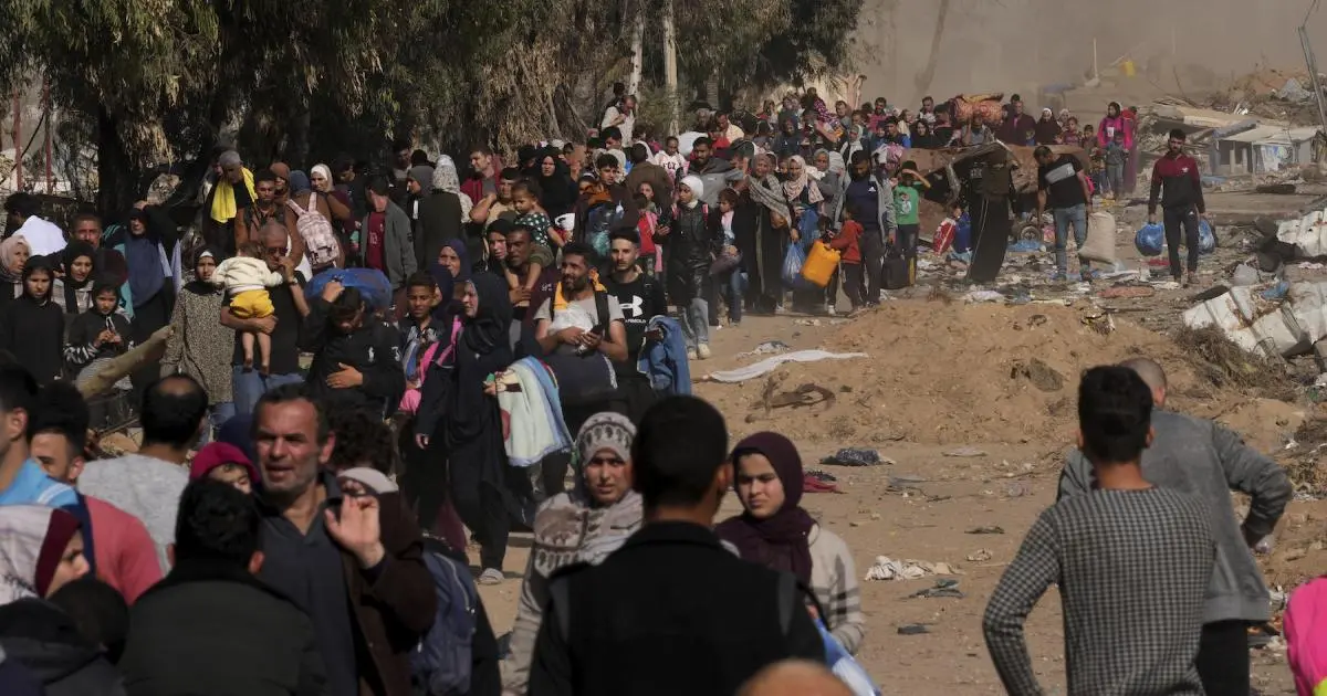 Palestinians running for shelter in Gaza during Israeli airstrikes