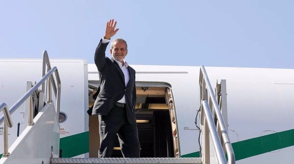 Iranian President Masoud Pezeshkian disembarks from aircraft during official visit