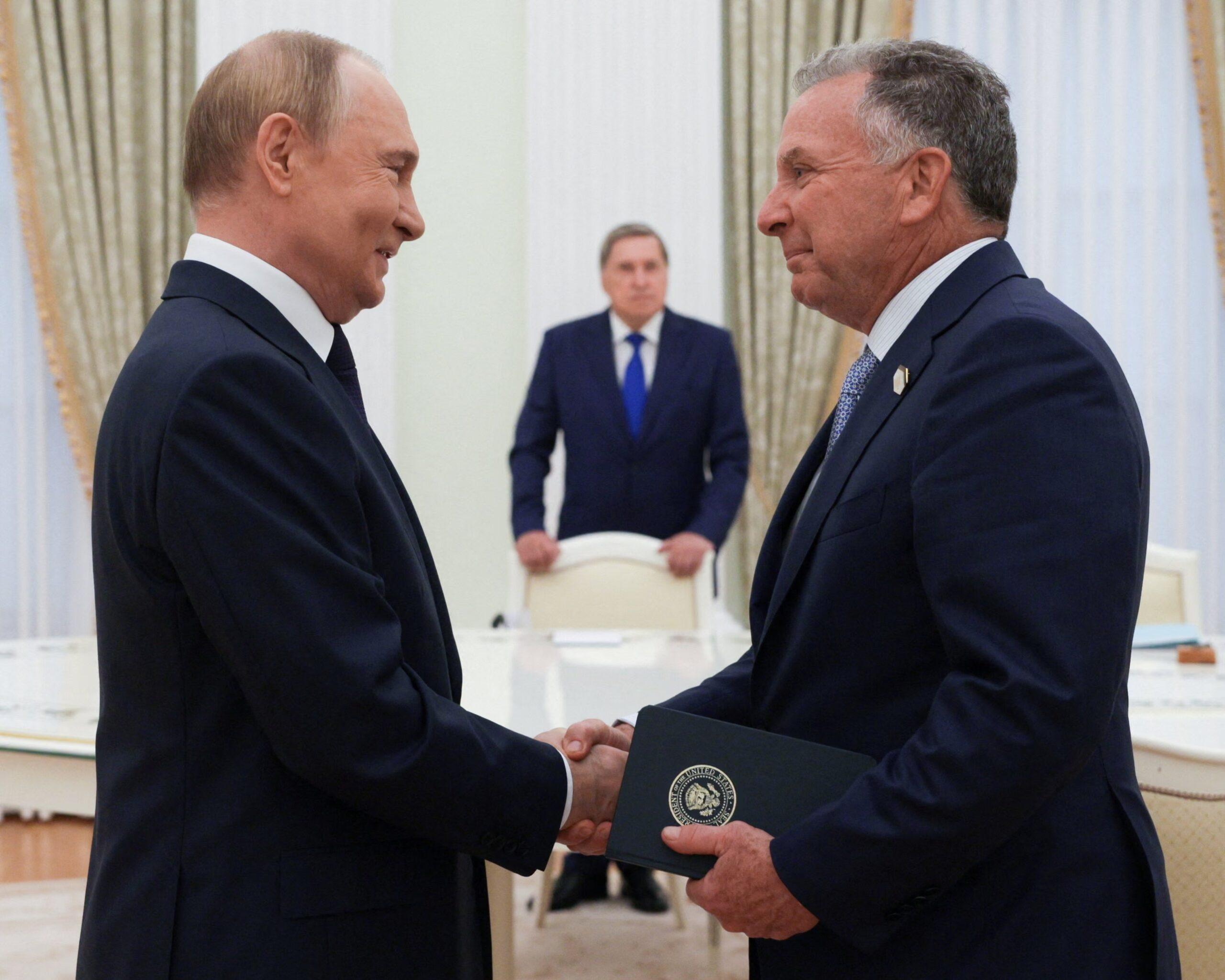 Putin and Steven Witkoff sitting across from each other during Moscow meeting