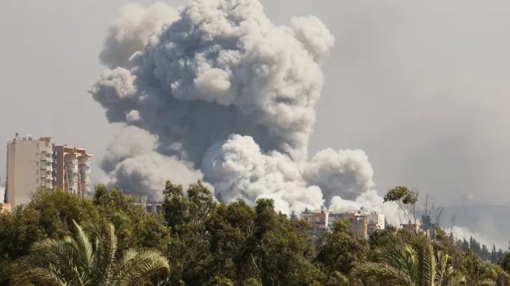 Beirut suburbs in flames after Israeli missile strike despite ceasefire.