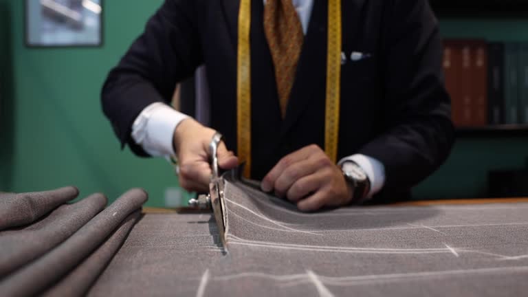 Armani atelier pattern cutting symbolizing the structured sale timeline and governance perimeter Armani atelier pattern cutting symbolizing the structured sale timeline and governance perimeter