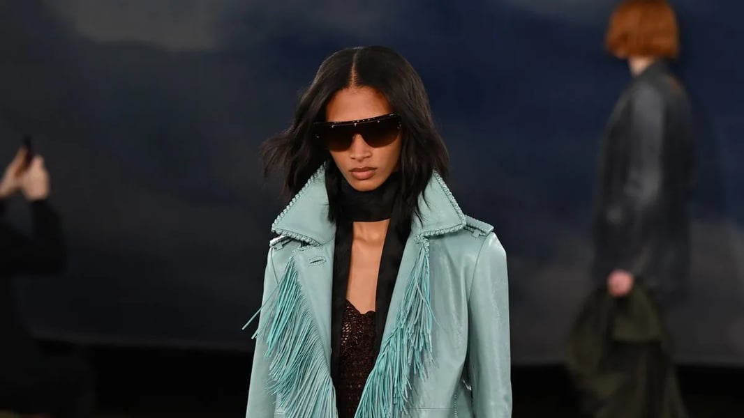 Burberry Spring 2026 runway under sky-blue tent at Perks Field, London Fashion Week