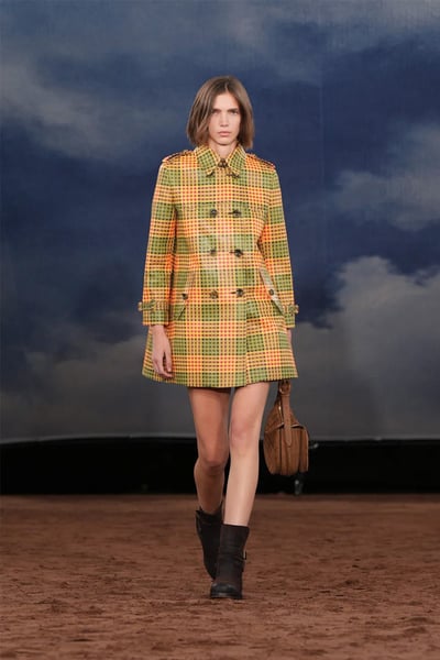 Skinny Scarf And Fringed Bag Skinny scarf layered over blazer and fringed shoulder bag at Burberry Spring 2026